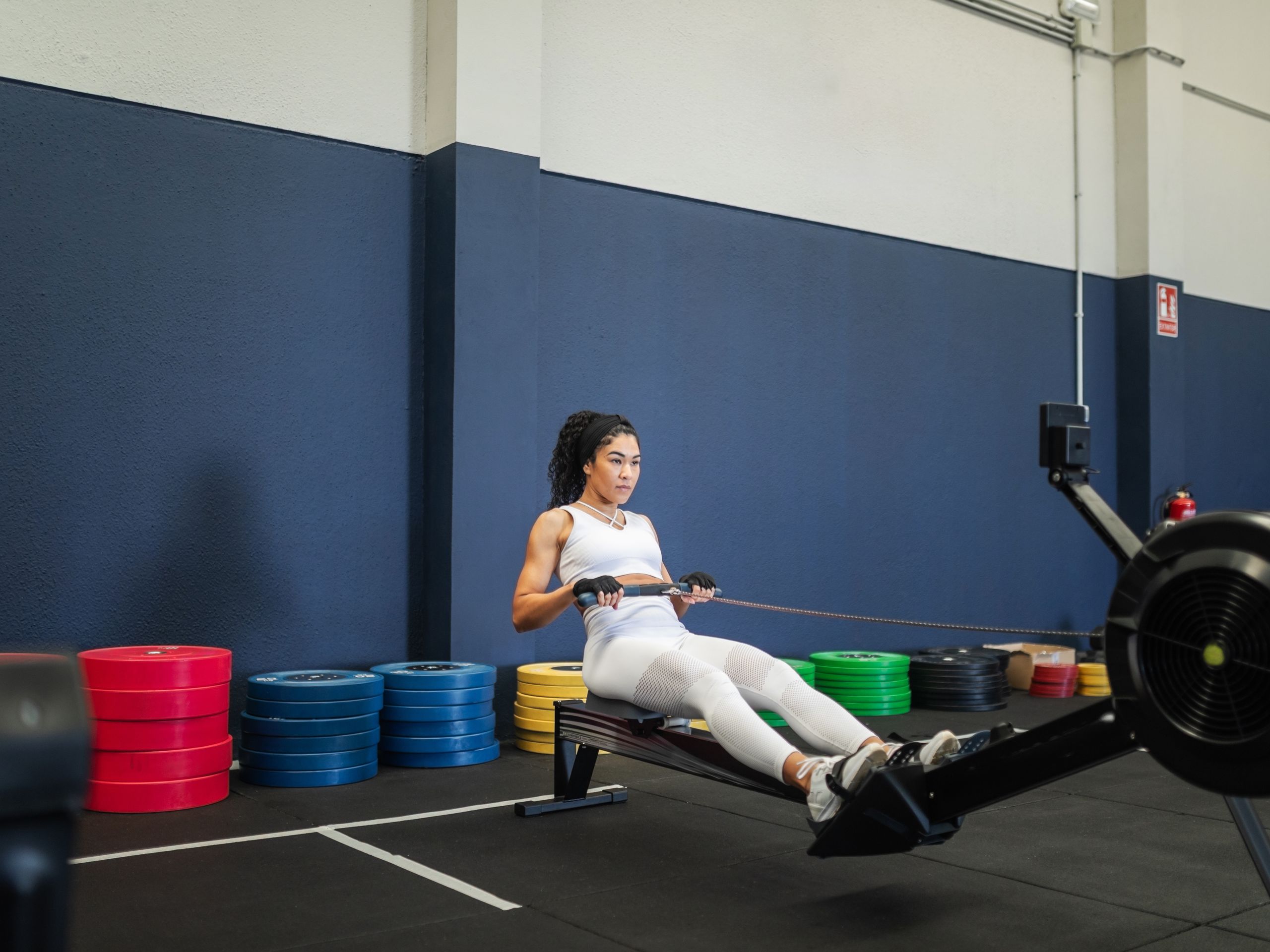 Image may contain Adult Person Fitness Gym Rowing Machine Sport and Working Out