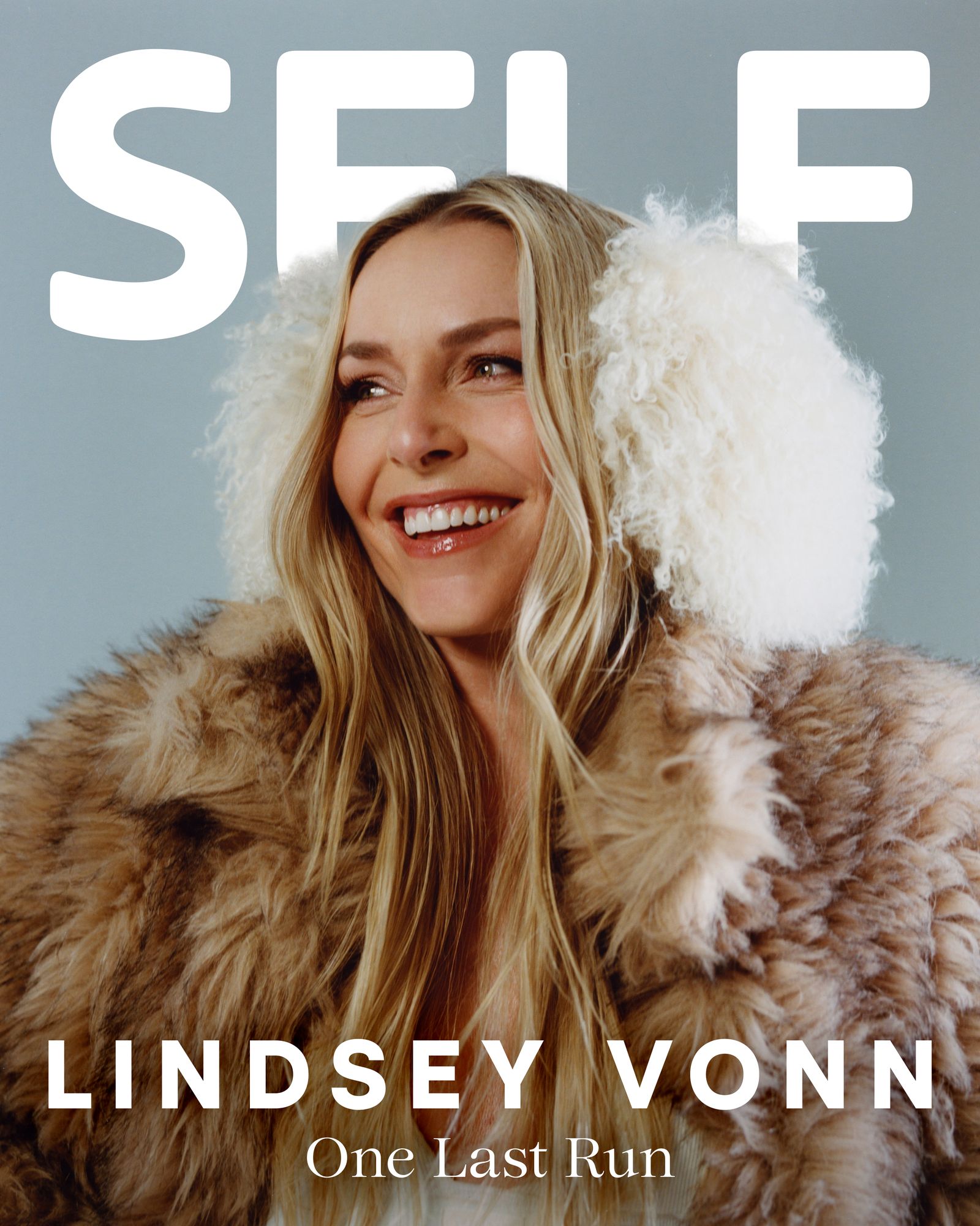 Image may contain Lindsey Vonn Face Happy Head Person Smile Blonde Hair Clothing Coat Fur Adult and Photography